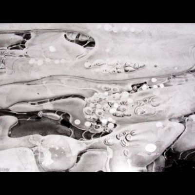 Peter de Lory, "Stream Ice," Weston, Massachusetts, 1973 — a black-and-white close-up of rippled, bubble-flecked ice over a stream, its wrinkled surface catching soft light.