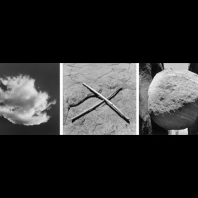 Three black-and-white photographs: a solitary cumulus cloud against a dark sky, two crossed sticks laid deliberately on a sandstone slab, and a large rounded boulder wedged between rock walls.