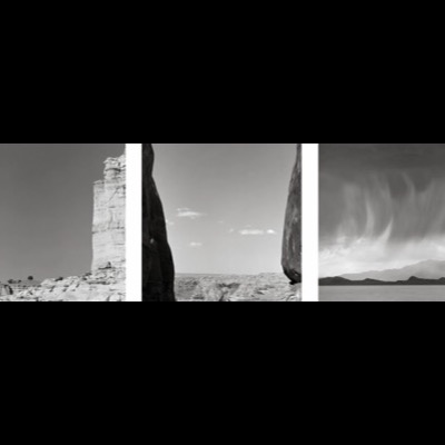 Three black-and-white photographs: a lone figure standing in a narrow canyon between towering sandstone cliffs, two ravens gliding over a pale sandstone dome, and a dead tree silhouetted with the crescent moon behind bare branches.
