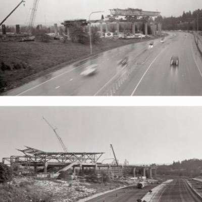 Black-and-white photograph at dusk of a partially built elevated station platform on concrete columns, construction materials and a freight train visible below.
